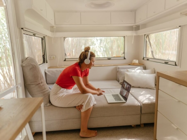 woman relaxing on comfortable upholstered caravan seating