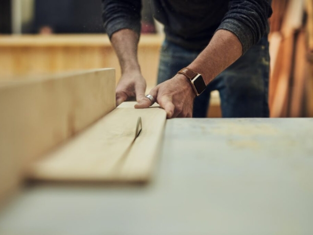wooden board for tailor made furniture project being cut